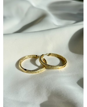 Gold hoop earrings with...